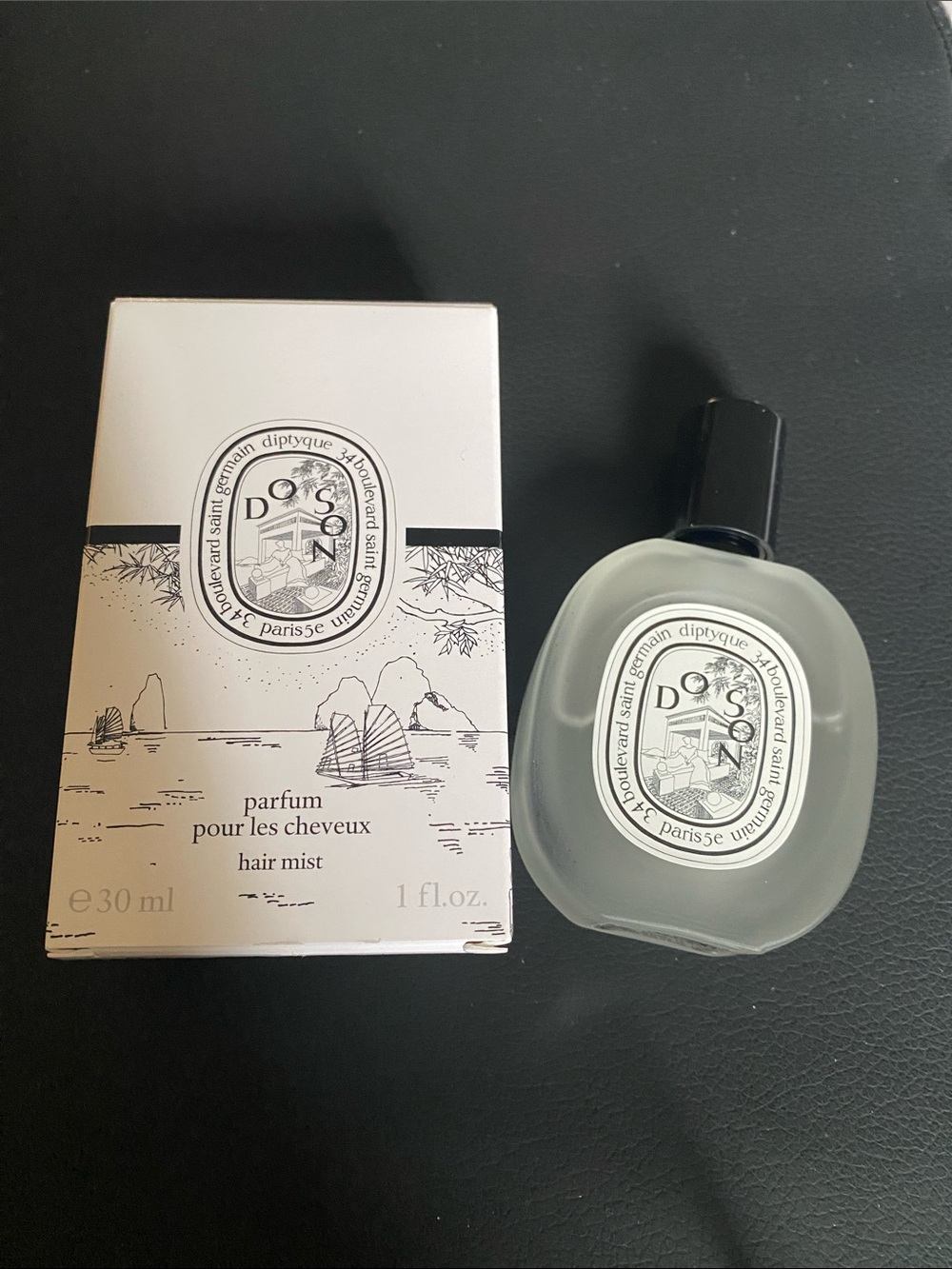 diptyque Do Son Hair Mist in cream and black bottle